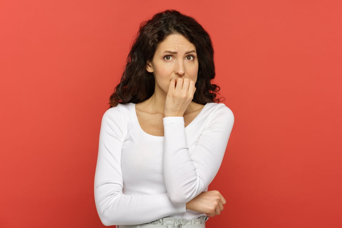 Worried Woman Biting Nails